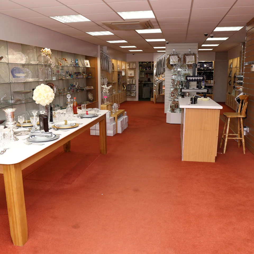The bright interior of Eichler's Gifts with gifts displayed on glass shelving