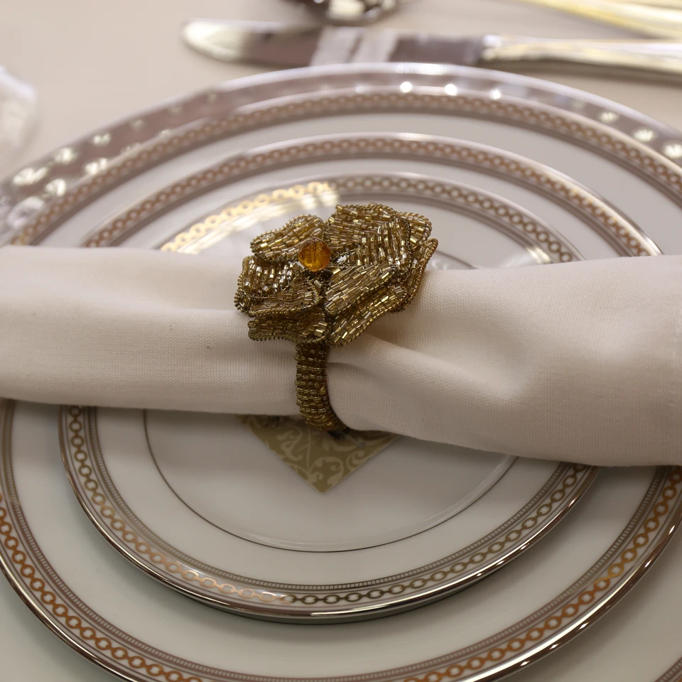 Silver and gold tableware arranged for a special occasion